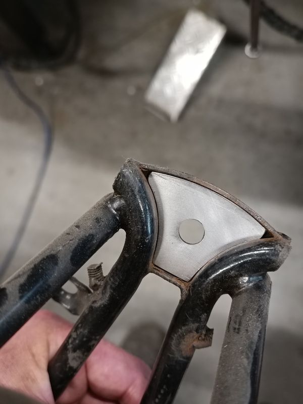 Rear frame suspension block mount hole fixer