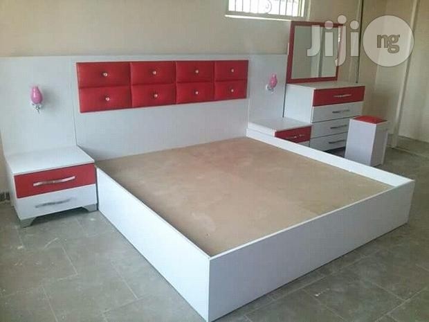 Bed with dressing mirror