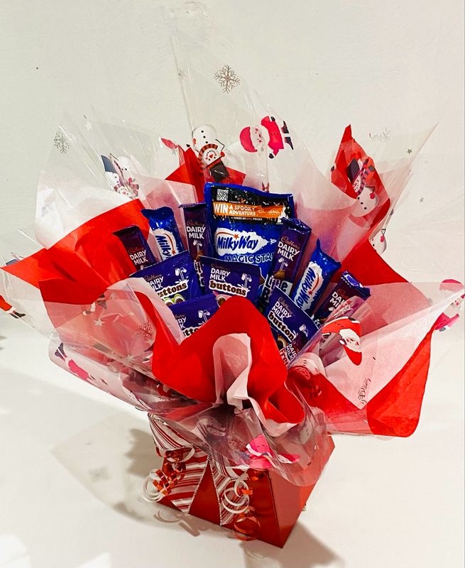 Cadbury Buttons, Dairy Milk, Freddo's, Milky Ways and Magic Stars Chocolate Bouquet (Large) Cadbury Buttons, Dairy Milk, Freddo's, Milky Ways and Magic Stars Chocolate Bouquet (Large)