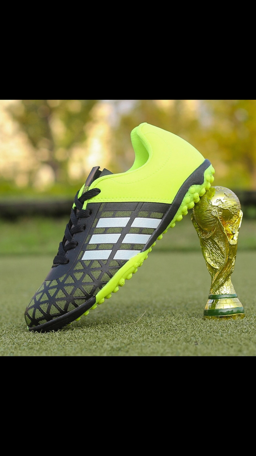 Green and black football trainers