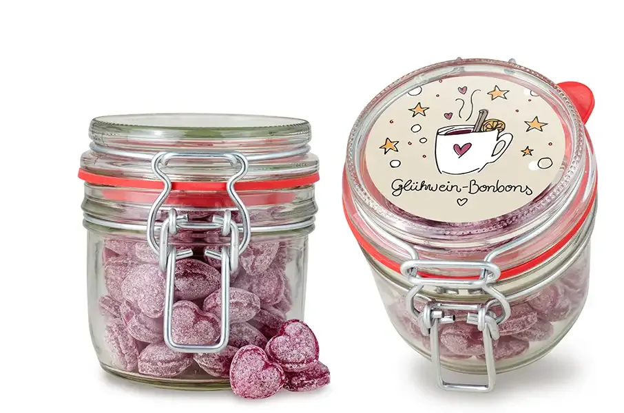 Glühweinbonbons in Herzform (ohne Alkohol), verpackt im Bügelglas mit Klebeetikett inklusive Digitaldruck als Werbegeschenk