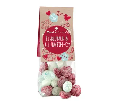 Naschbeutel Glühweinherzen & Eisblumen Glühweinherzen und Eisbonbons, verpackt in Blockbodenbeutel mit Karton-Werbereiter inklusive Digitaldruck als Werbeartikel