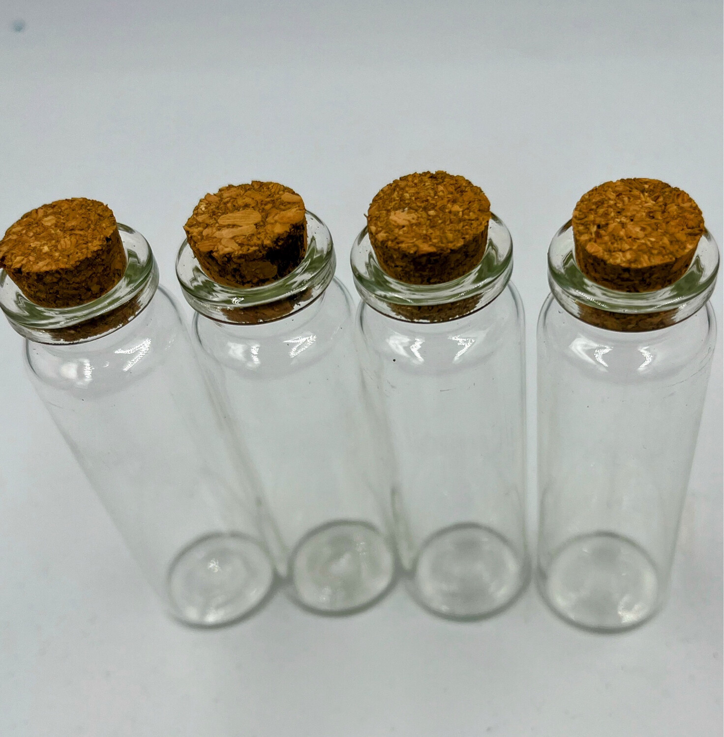 Set Of 4 Mini glass Bottles With Cork Stopper