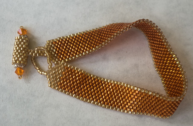 Orange and gold slinky beaded bracelet &quot;Georgia&quot;