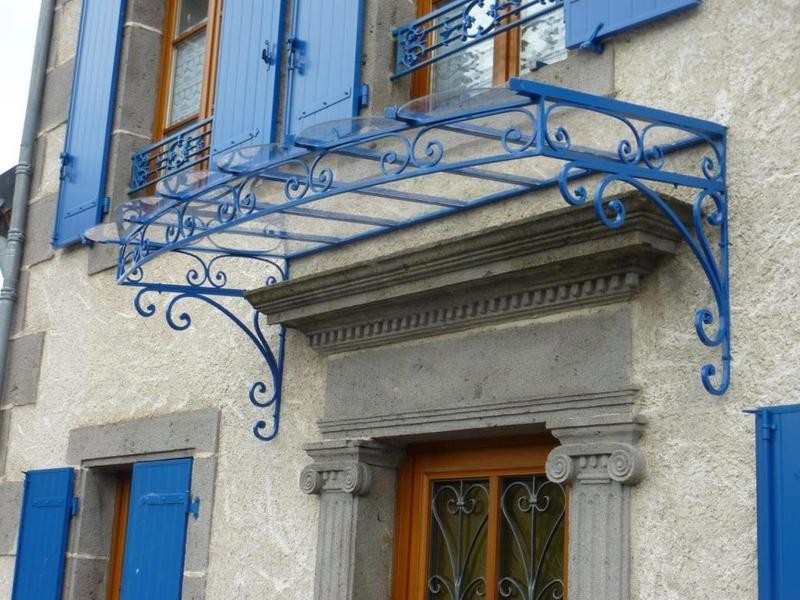marquise cintrée en façade,fer forgé