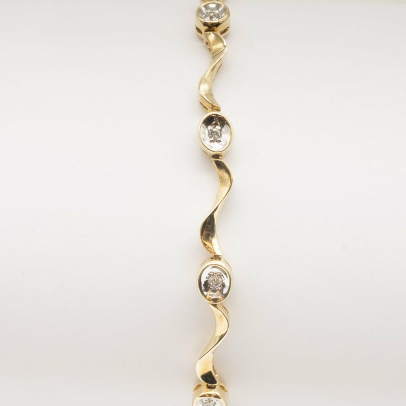 9ct yellow gold twisted 'wave' link diamond set bracelet