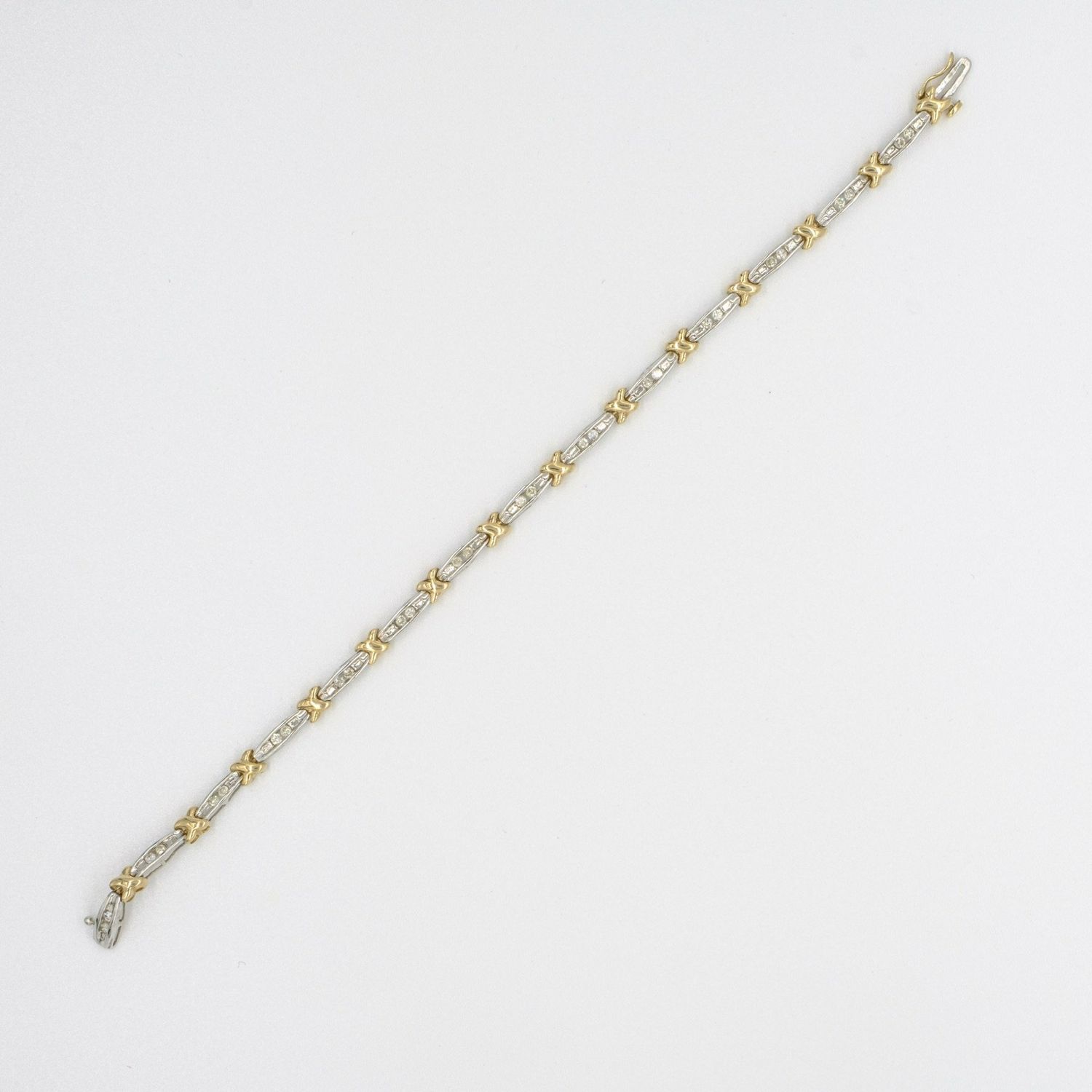 9ct yellow & white gold diamond 'kiss' design bracelet