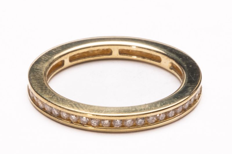 Diamond channel set full eternity 18ct yellow gold ring