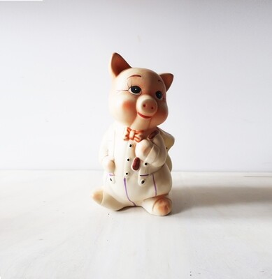 Vintage piggy bank in suit with backpack Vintage piggy bank in suit with backpack