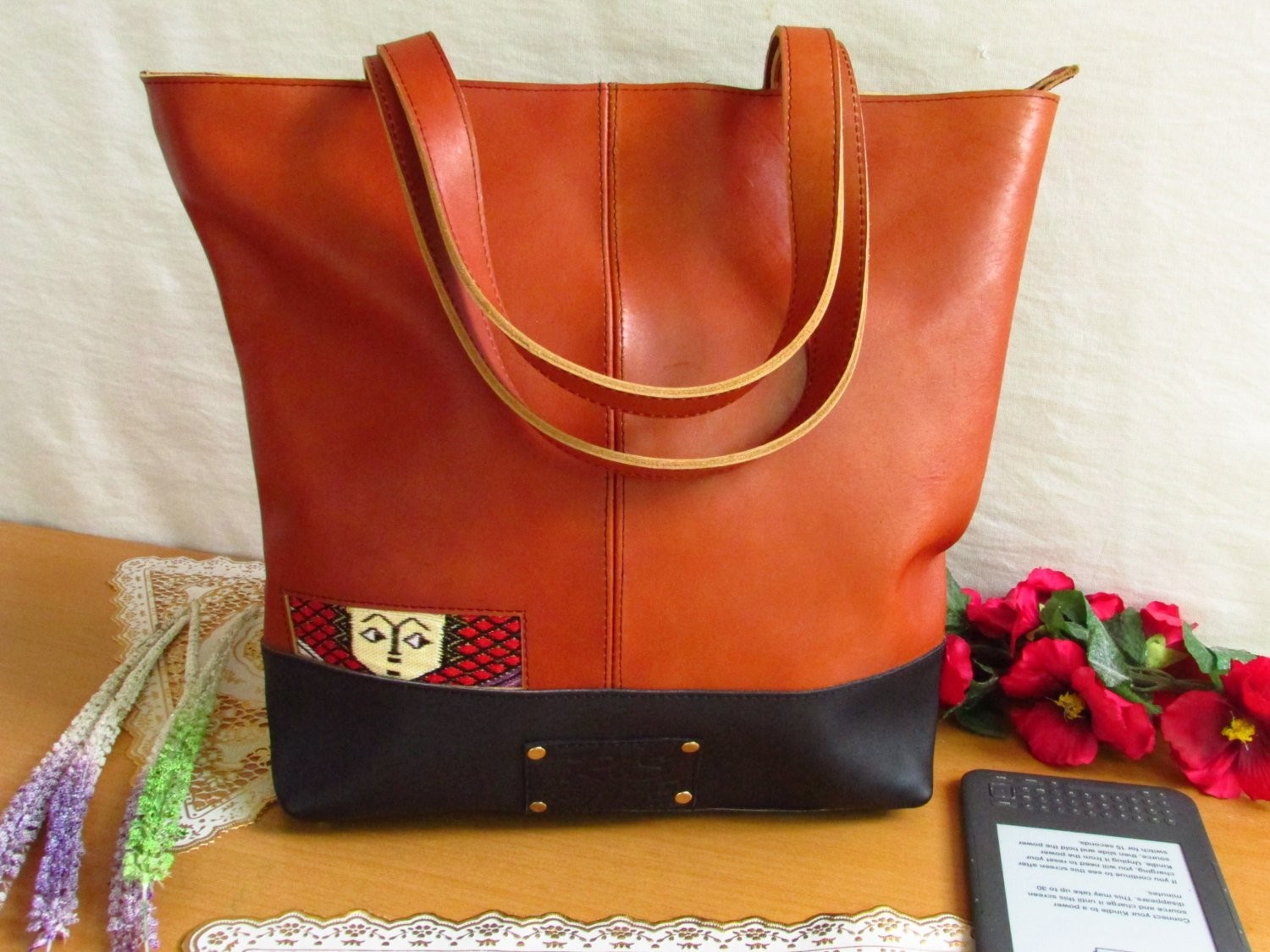 Brown leather tote ethio face