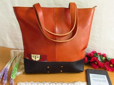 Brown leather tote ethio face