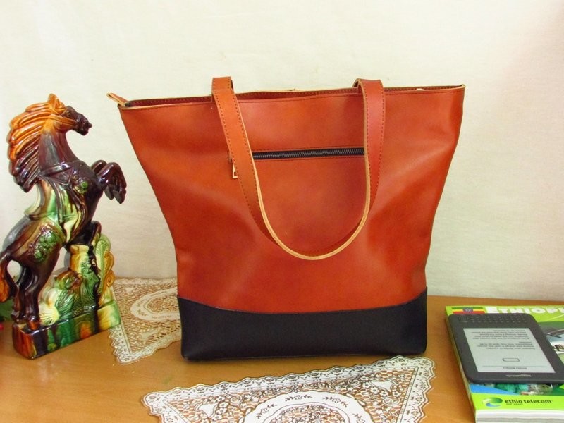 Brown leather tote ethio face