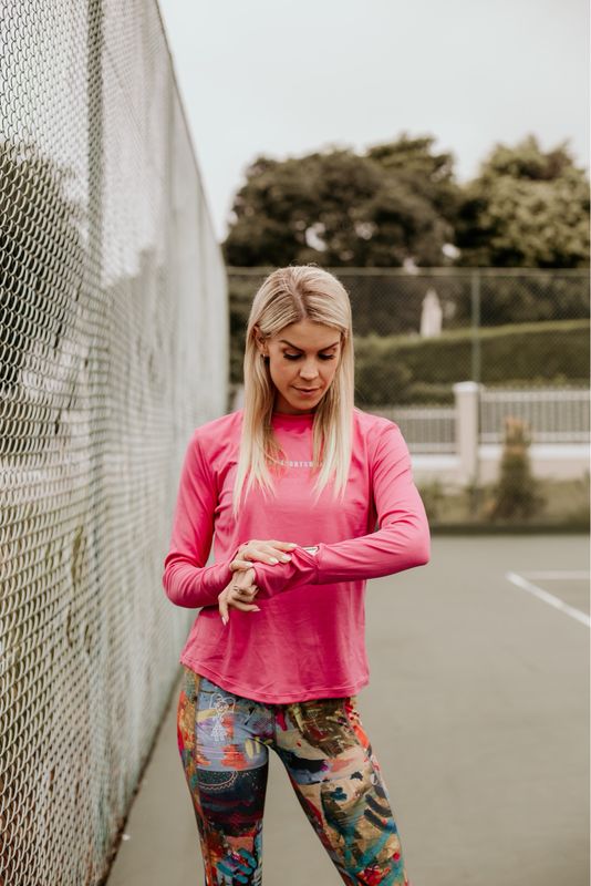cerise pink long sleeve top with watch viewer
