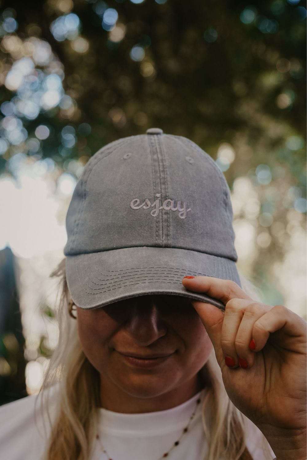 grey "esjay" cap