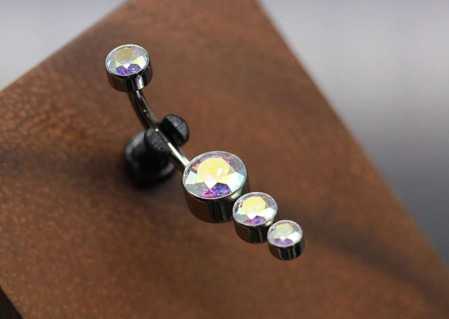 Le Roi Titanium bezel Navel Curve with 5mm , 4mm and 3mm Aurora Borealis czl bottom and 4mm aurora Borealis top