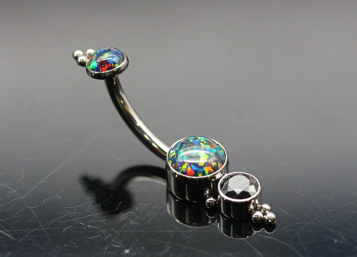 Le Roi Titanium bezel Navel Curve with Synthetic Black Opal 5mm and 4mm Black CZ bottom and 4mm Synthetic Black Opal top