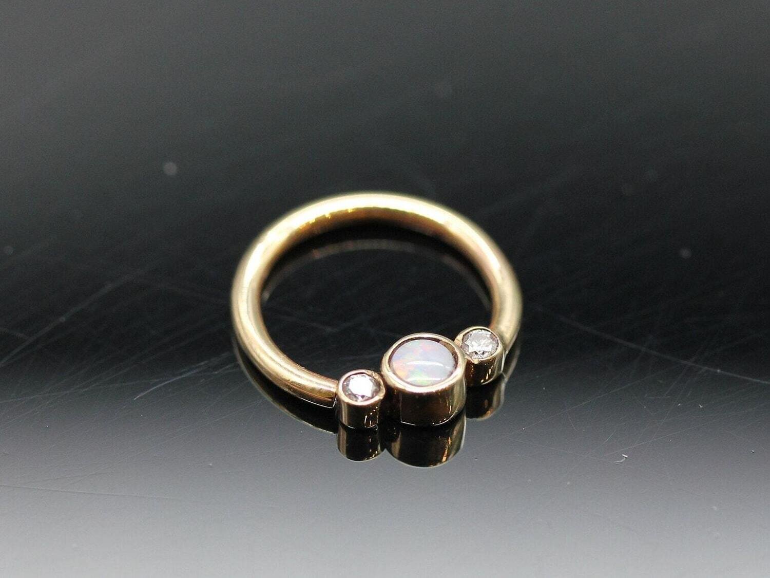 16g or 18g  Solid 14k Gold  (NOT plated or filled)  With 3mm AAA real White Opal Center and 1.7 mm Real Diamond side stones
