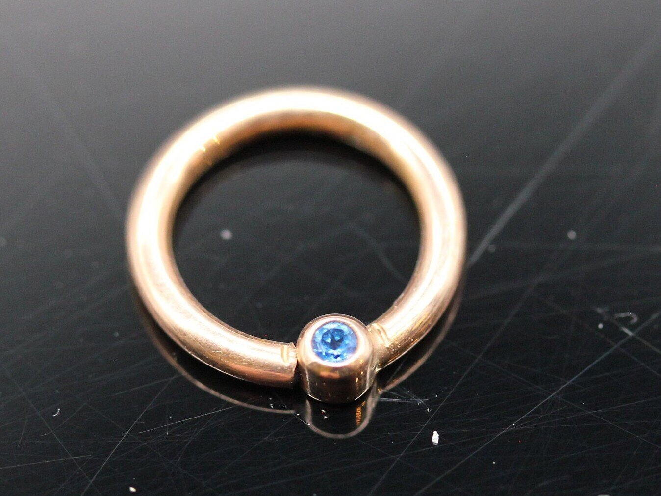 16g or 18g  Solid 14k Gold  (NOT plated or filled)  With Real 2mm Swiss Blue Topaz