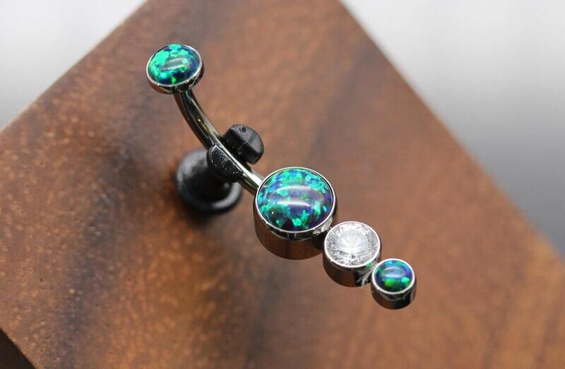 Le Roi Titanium bezel Navel Curve with  5mm Synthetic peacock Opal , 4mm White CZ and 3mm Synthetic Peacock Opal bottom and top