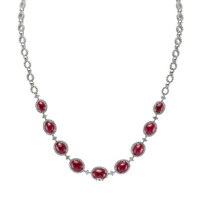 A 19.48 Ct. Ruby and Diamond Necklace, 18K White Gold. The necklace primarily features with 9 red oval shaped cabochon cut rubies. 209 round diamonds 1.86 ctw vs2 grade
