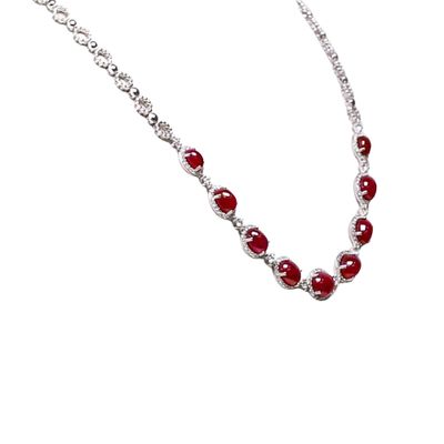 A 19.48 Ct. Ruby and Diamond Necklace, 18K White Gold. The necklace primarily features with 9 red oval shaped cabochon cut rubies. 209 round diamonds 1.86 ctw vs2 grade