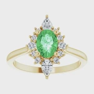 14K Yellow 7x5 mm Oval AA Tsavorite Garnet with1/3 CTW Diamond accents Halo-Style ring. Diamonds are Clarity, Color SI2-SI3, GHI, G-H :: 3/8 CTW