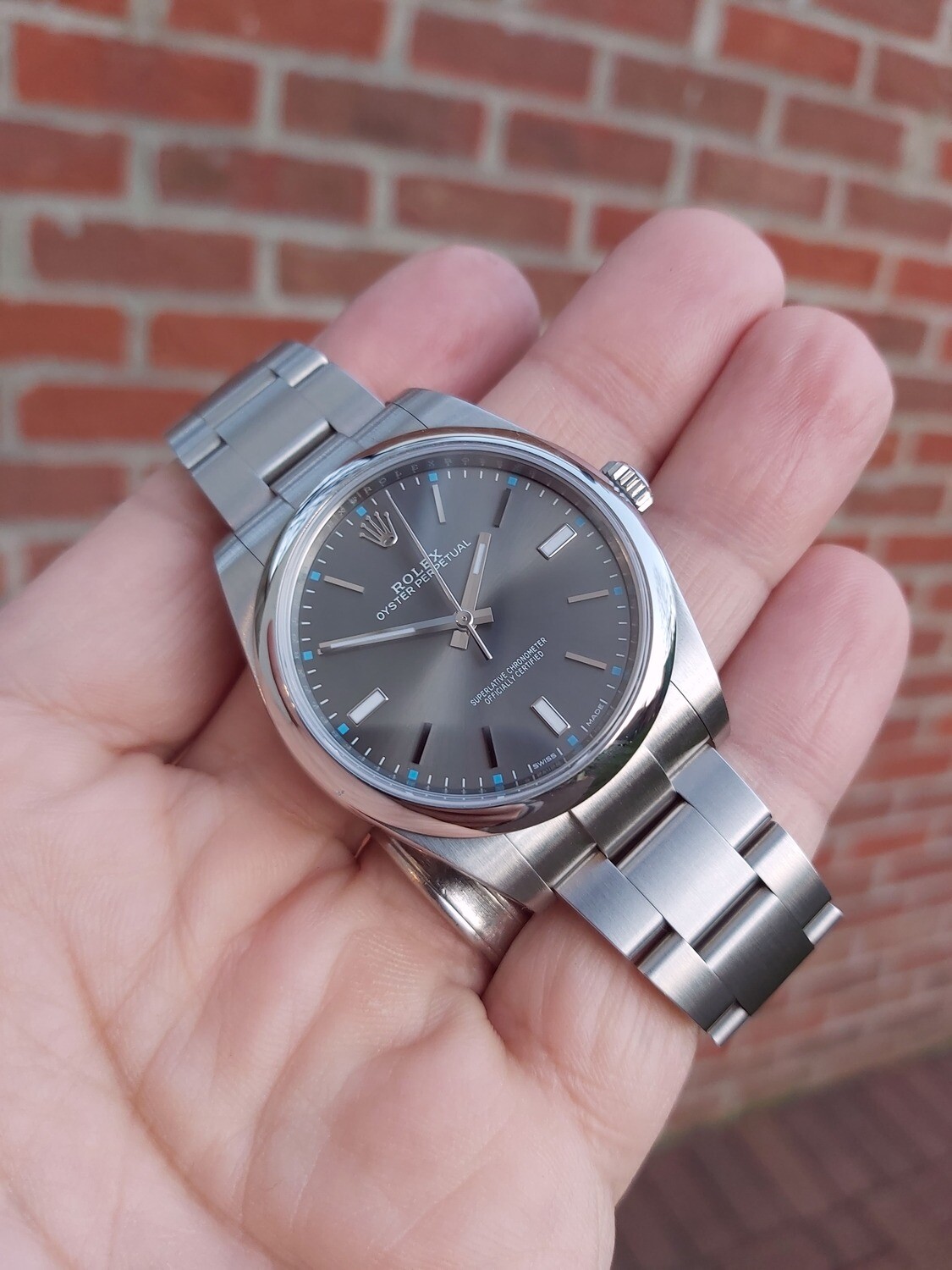 rolex oyster perpetual 114300 rhodium