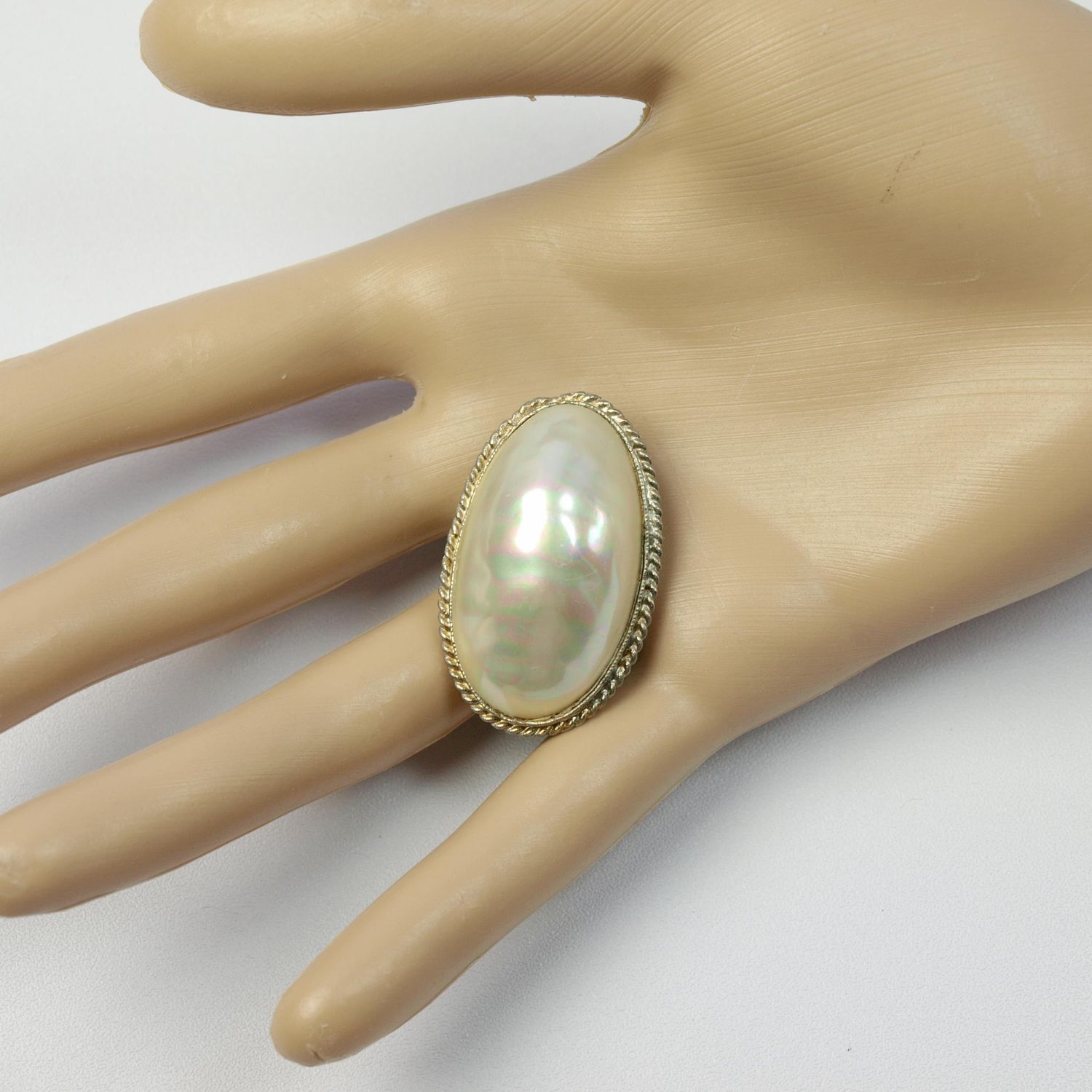 Vintage Mabe Pearl &amp; Goldtone Brooch.
Huge mabe pearl with the most beautiful pearlescence in pink, green and silky cream. De