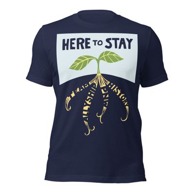 front of navy T-shirt with lettering "HERE TO STAY" over sprout with roots "TEAM," "ALLYSHIP," "PNW," and "HISTORY"