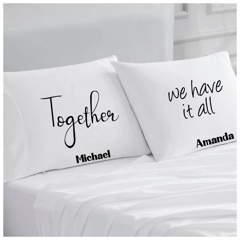 Personalized couples pillowcases with two names printed in a warm, romantic design on soft white fabric.
