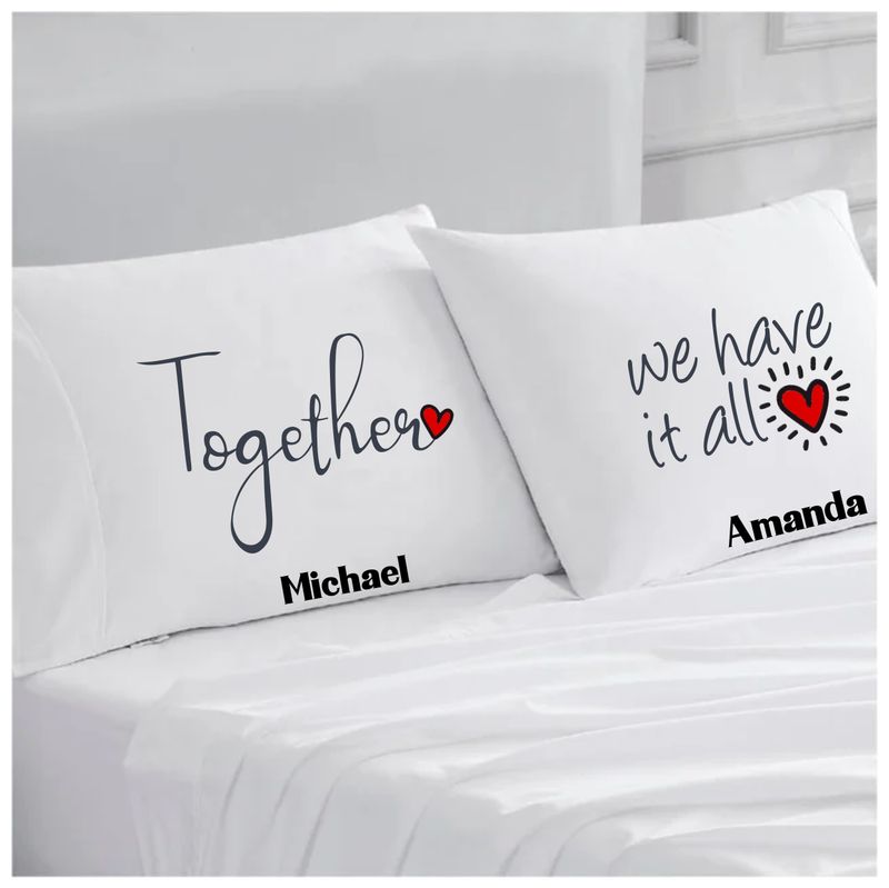 Personalized couples pillowcases with two names printed in a warm, romantic design on soft white fabric.