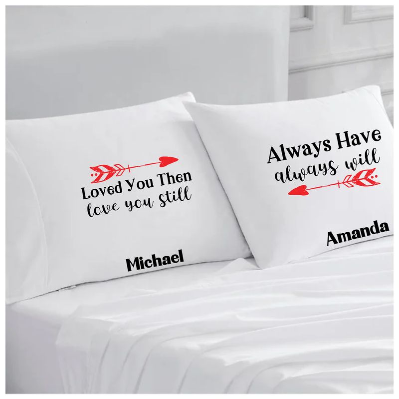Personalized couples pillowcases with two names printed in a warm, romantic design on soft white fabric.