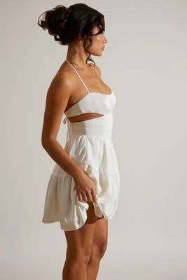 Women's Premium Quality white halter neck mini dress with cut-out details and a ruffled skirt.- 100 Pc