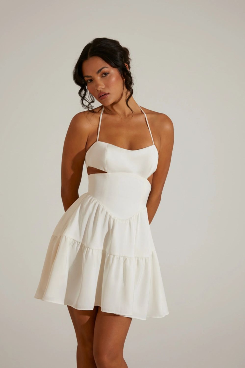 Women's Premium Quality white halter neck mini dress with cut-out details and a ruffled skirt.- 30 Pc