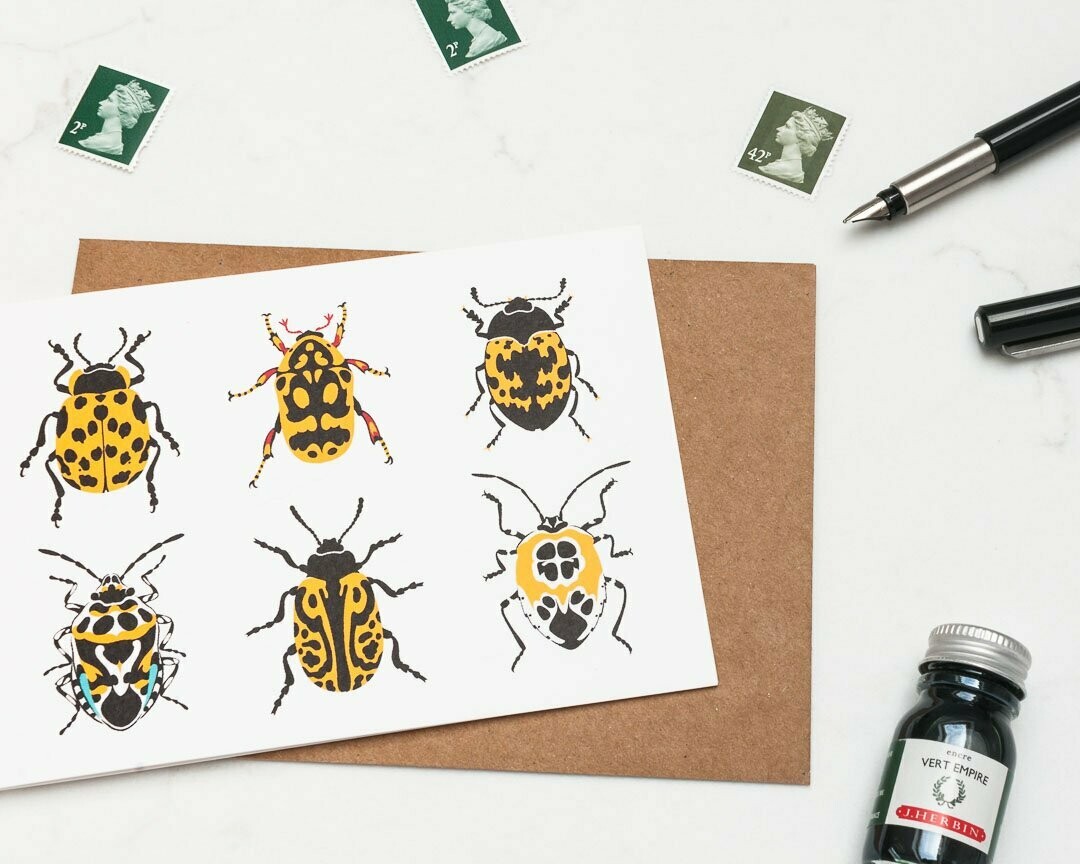 Yellow beetles greeting card