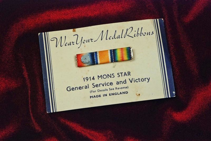 BRITISH WORLD WAR I MEDAL TRIO RIBBON BAR w/MONS STAR DEVICE ON ORIGINAL MANUFACTURER'S CARD - MINIATURE SIZE BRITISH WORLD WAR I MEDAL TRIO RIBBON BAR w/MONS STAR DEVICE ON ORIGINAL MANUFACTURER'S CARD - MINIATURE SIZE