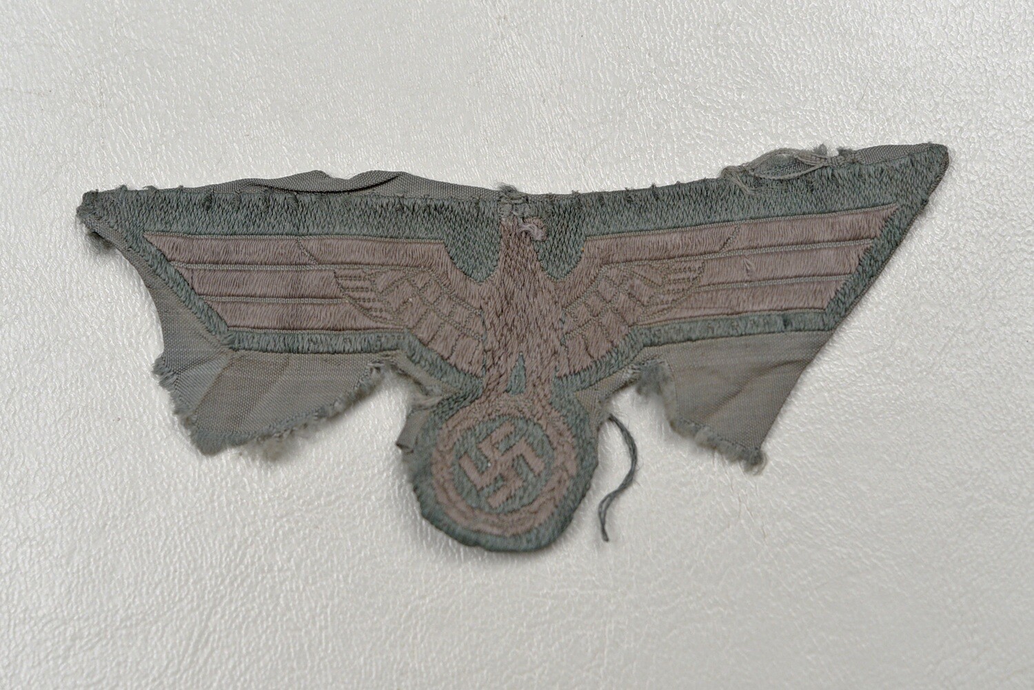 WWII GERMAN MODEL 1944 BREAST EAGLE ON CAMO CLOTH - CUT FROM UNIFORM