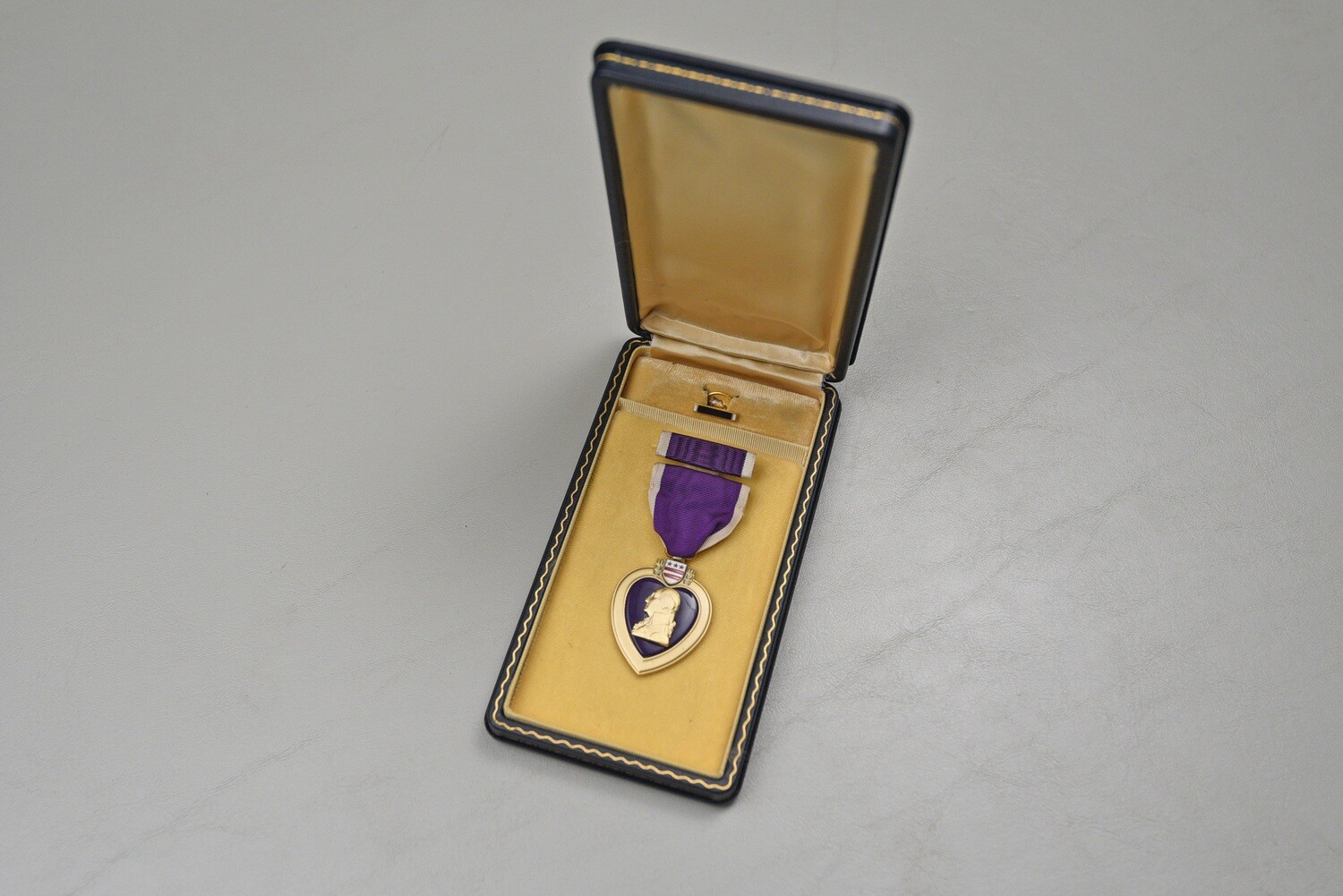 WWII PURPLE HEART MEDAL IN BLACK LEATHERETTE CASE