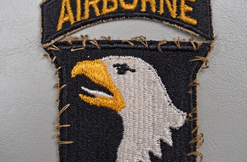 WWII U.S. 101st AIRBORNE DIVISION SHOULDER PATCH - WHITE TONGUE, UNIFORM REMOVED