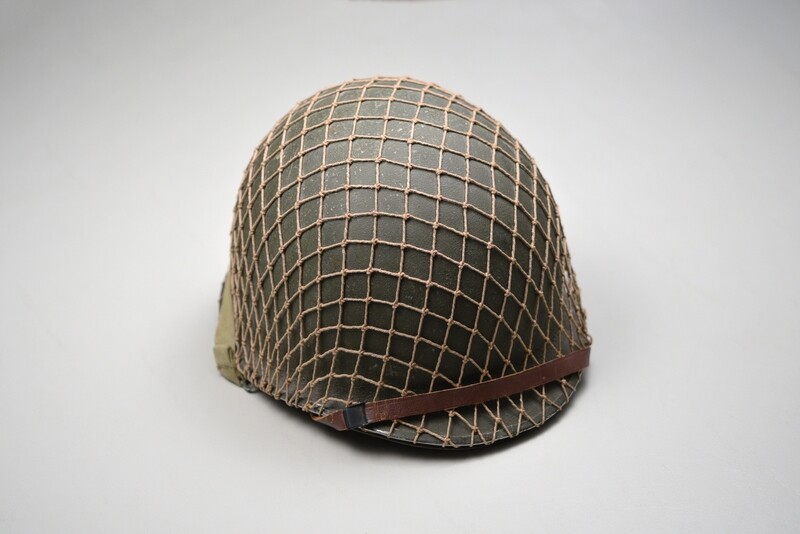WWII U.S. M1 HELMET w/OD INVASION NET - FRONT SEAM WWII U.S. M1 HELMET w/OD INVASION NET - FRONT SEAM