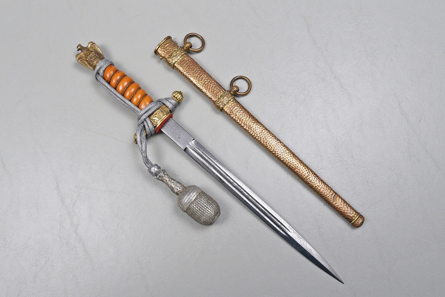 WWII GERMAN KRIEGSMARINE OFFICER&#39;S DAGGER BY W.K.C. - ORANGE GRIP, HAMMERED SCABBARD, KNOT
