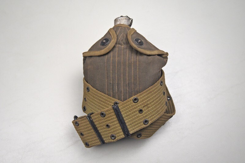 WWII U.S. MODEL 1910 CANTEEN, CARRIER, &amp; CUP DATED 1942 ON 1943 DATED PISTOL BELT