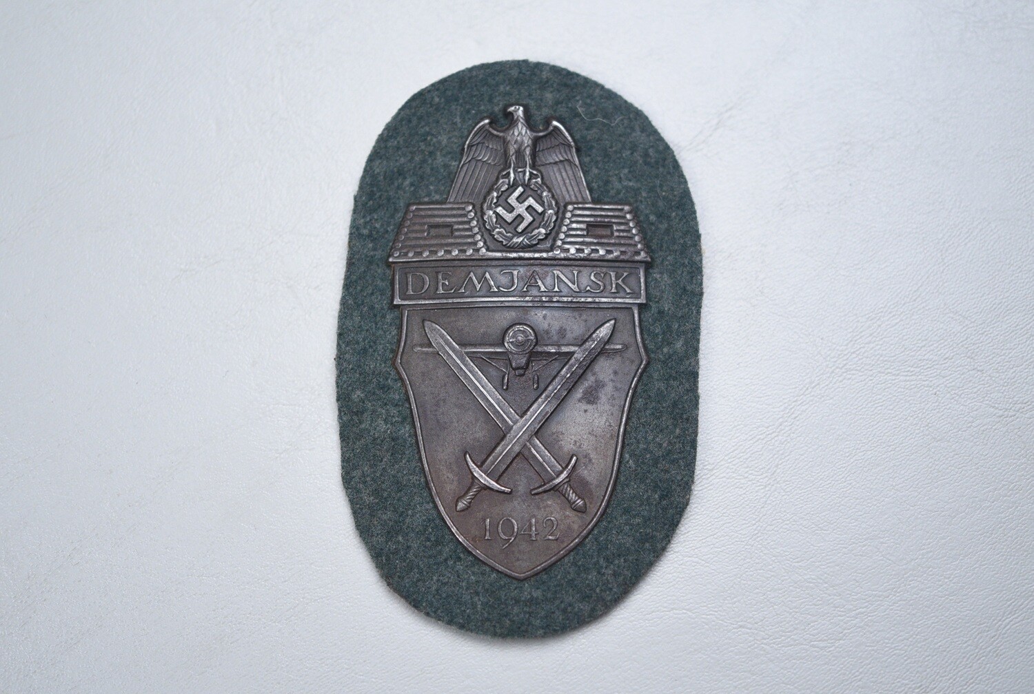 WWII GERMAN DEMJANSK SHIELD ON ARMY BACKING