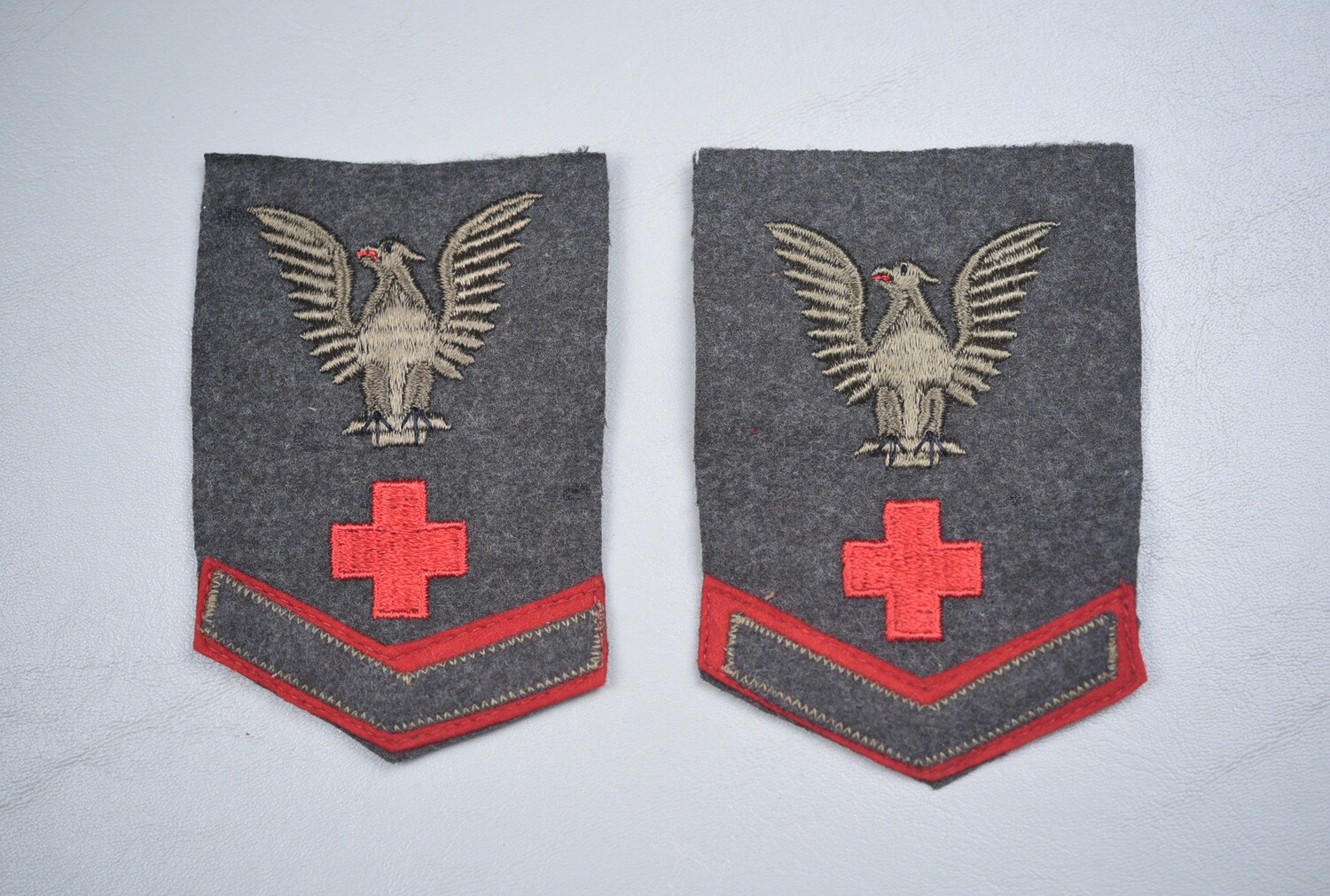 WWII U.S. NAVY HM3 CORPSMAN SLEEVE INSIGNIA PAIR ON FOREST GREEN WOOL