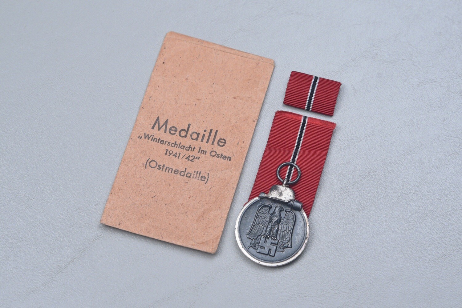 WWII GERMAN RUSSIAN FRONT MEDAL w/RIBBON BAR – MAKER MARKED IN TITLED ENVELOPE