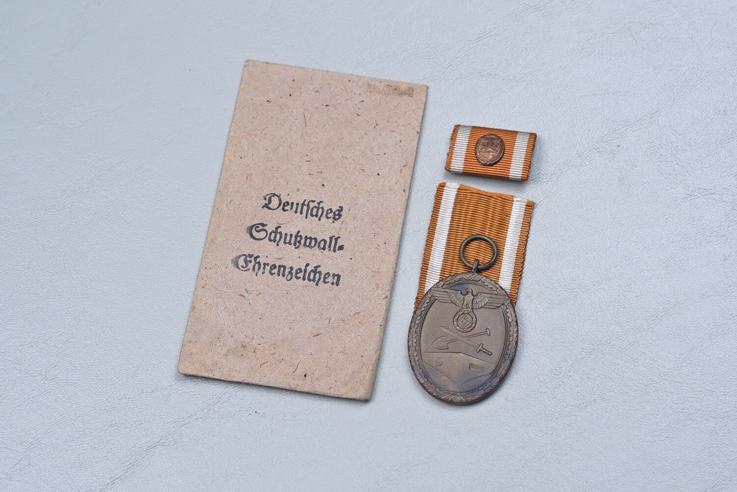 WWII GERMAN WEST WALL MEDAL IN TITLED PACKET - MAKER MARKED