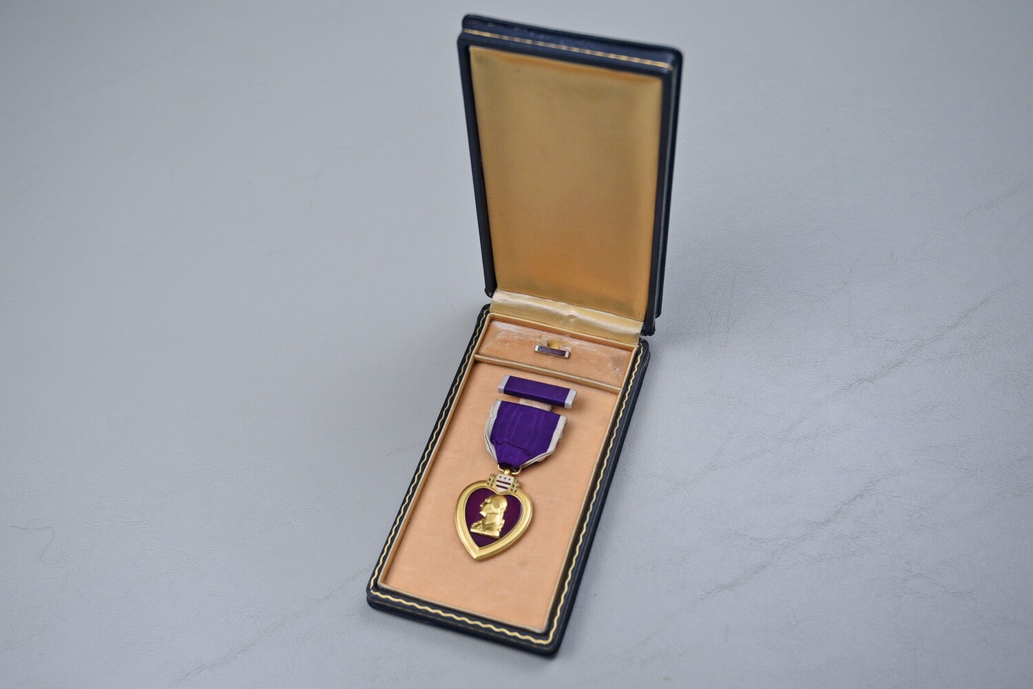 WWII U.S. PURPLE HEART MEDAL IN BLACK LEATHERETTE CASE - NUMBERED