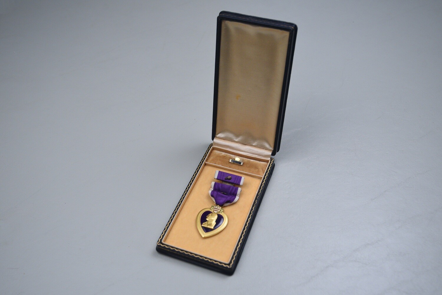 WWII U.S. PURPLE HEART MEDAL SET IN BLACK LEATHERETTE CASE
