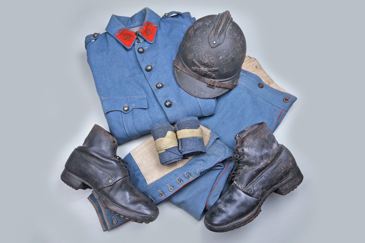 WWI FRENCH ARTILLERY UNIFORM JACKET, TROUSERS, PUTTIES, BOOTS, &amp; HELMET GROUP
