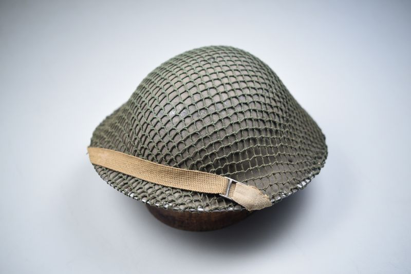 WWII BRITISH MK II ‘TOMMY’ HELMET w/ORIGINAL NET BY J.S.S. – DATED 1938 WWII BRITISH MK II ‘TOMMY’ HELMET w/ORIGINAL NET BY J.S.S. – DATED 1938